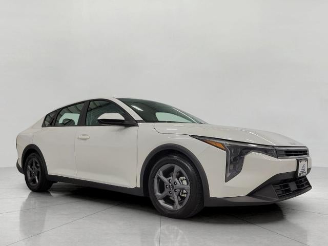 2025 Kia K4 LXS in White — front three-quarter view